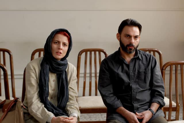 Simin (Leila Hatami) and Nader (Peyman Moadi) plead their case regarding divorce to the judge in the opening scene of the film.